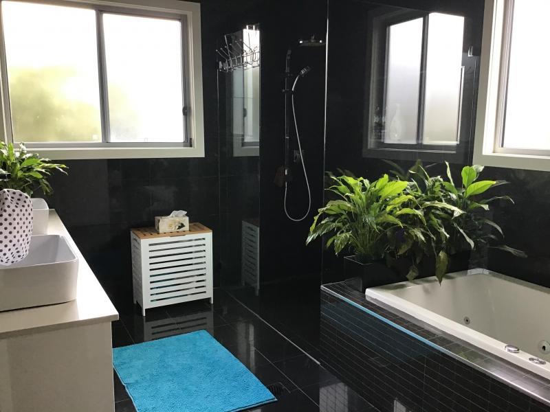 Homestay bathroom is just one step from the bedroom.